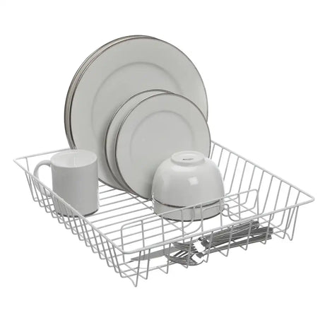 White dish rack with plates, mugs, and cutlery on a white background