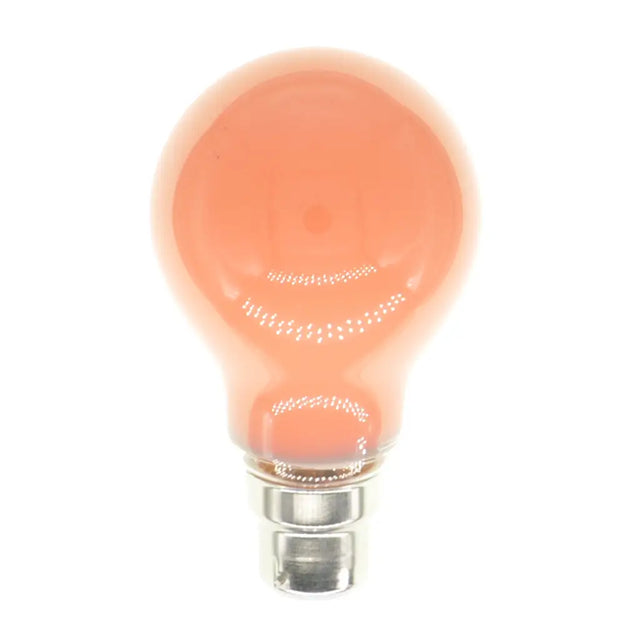 Peach-colored light bulb on a white background