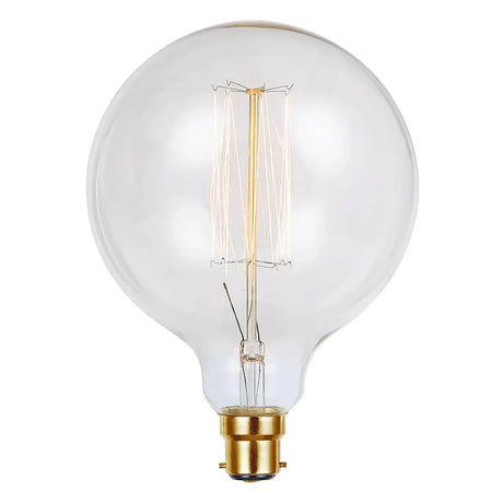 Clear light bulb with gold base on a white background