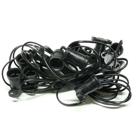 Pile of black plastic connectors on a white background