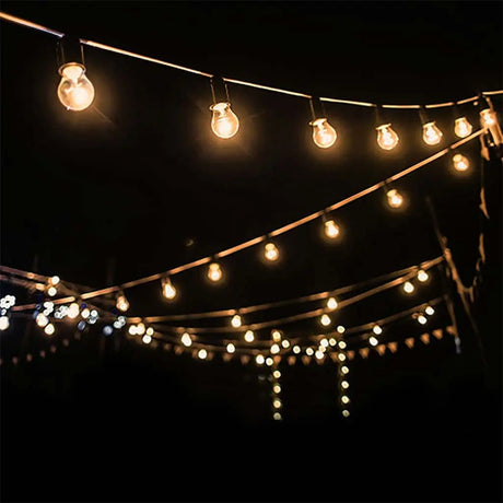 String of lights hanging against a dark background