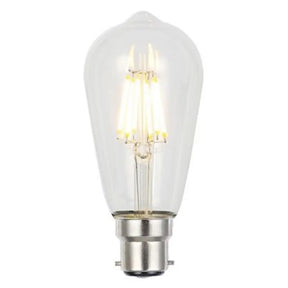 Clear light bulb with visible filament on a white background