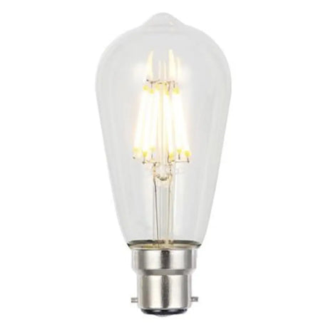 Clear light bulb with visible filament on a white background