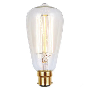 Clear light bulb with gold base on a white background