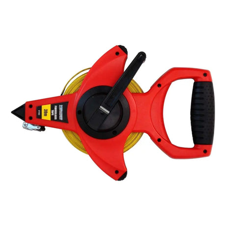 Red tape measure with black handle on a white background