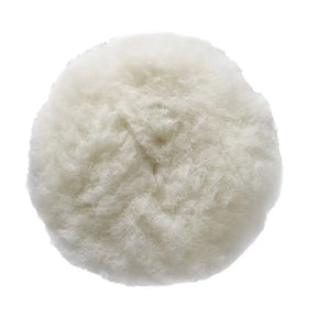 A round, fluffy faux fur or sheepskin cushion in an off-white color, shown from a top-down view on a solid white background.