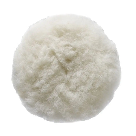A round, fluffy faux fur or sheepskin cushion in an off-white color, shown from a top-down view on a solid white background.