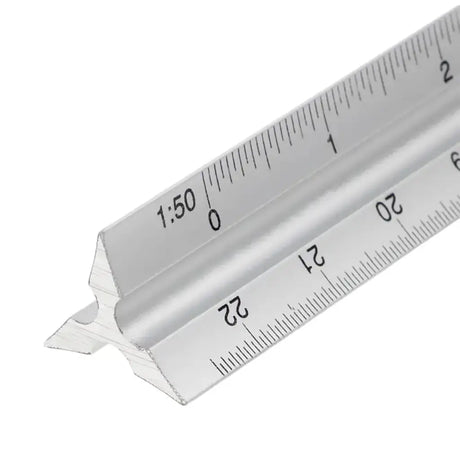Metal architectural scale ruler on a white background