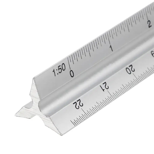 Metal architectural scale ruler on a white background