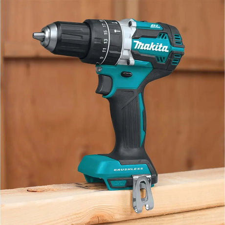 Makita cordless drill on a wooden surface with a wooden background