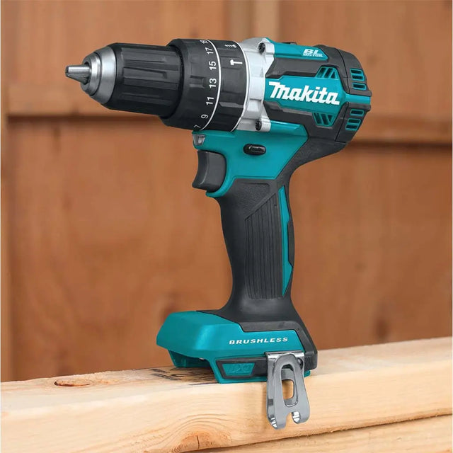 Makita cordless drill on a wooden surface with a wooden background