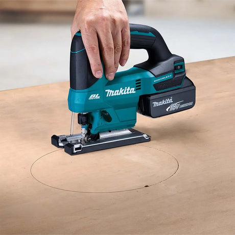 Makita jigsaw being used on a wooden surface