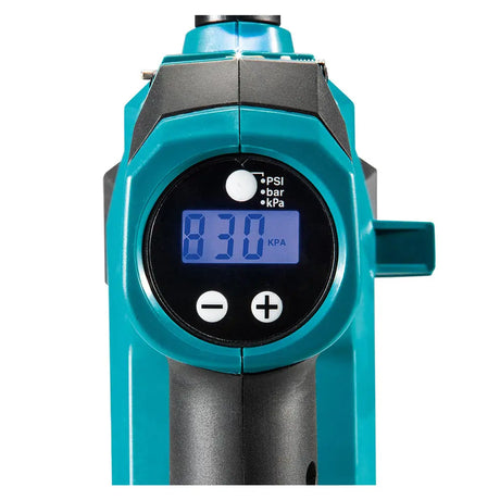 A digital pressure gauge with a teal and black body, featuring a blue backlit LCD screen displaying 830 KPA, set against a plain white background.