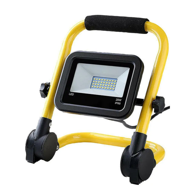 Yellow and black portable floodlight on a white background