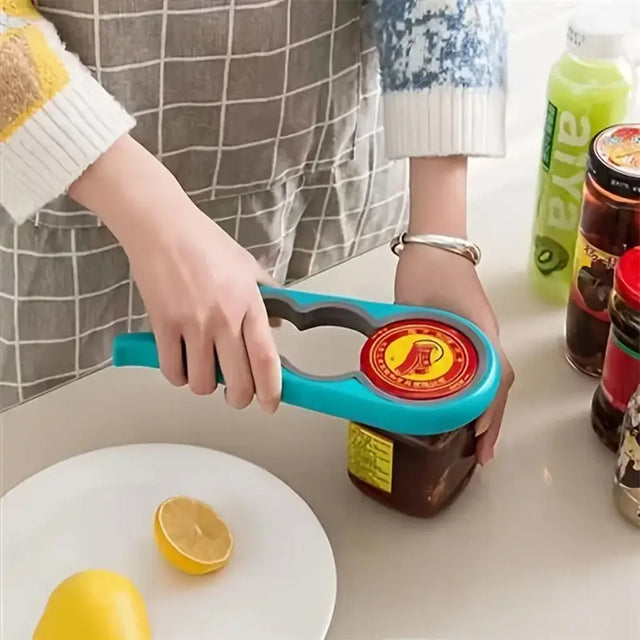 Person using a jar opener on a kitchen counter with lemons and other jars.