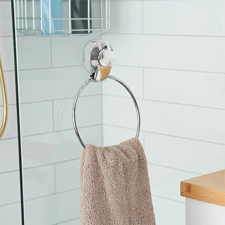 Towel ring with a towel hanging on it in a bathroom setting