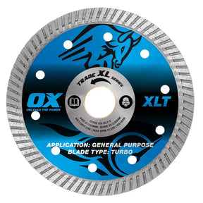 A circular diamond wet saw blade with a blue and black printed center label and a silver-gray abrasive outer rim, shown on a plain white background. Visible text includes 'OX', 'XLT', 'TRADE XL SERIES', and 'APPLICATION: GENERAL PURPOSE BLADE TYPE: TURBO'.