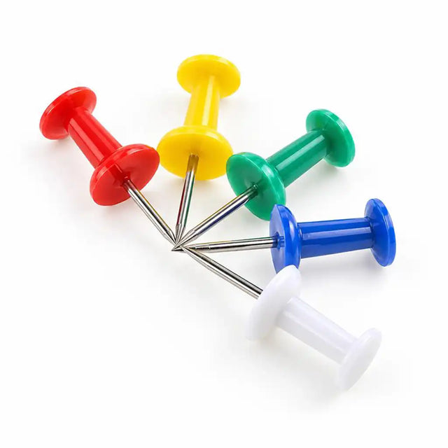Five plastic push pins in red, yellow, green, blue, and white, arranged in a fan shape on a white background.