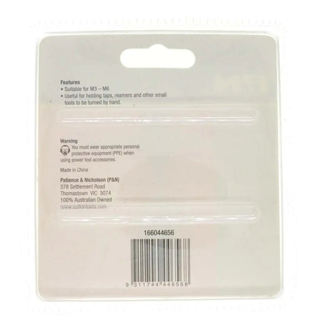 Back of a packaging card with text and a barcode on a white background