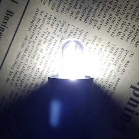 Light bulb on an old newspaper background