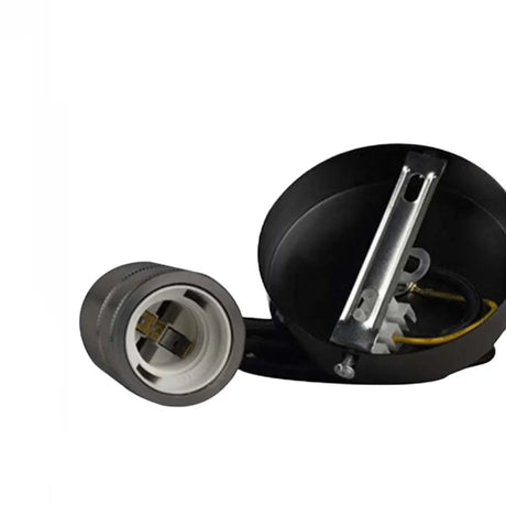 Mechanical component with black housing and metallic parts on a white background
