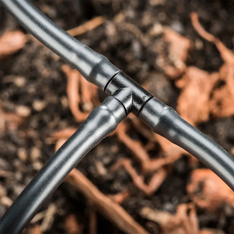Close-up of a irrigation pipe with a blurred natural background
