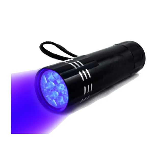 Black UV flashlight with purple light on a white background