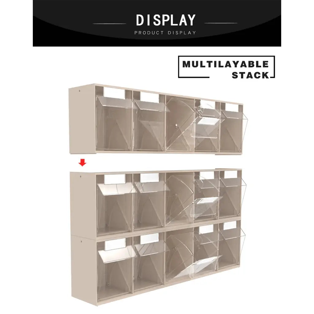 A wall-mounted display shelving unit with multiple clear plastic bins arranged in a stackable, multilayable layout. The image includes a black banner at the top reading 'DISPLAY PRODUCT DISPLAY' and a label at the top right reading 'MULTILAYABLE STACK'.