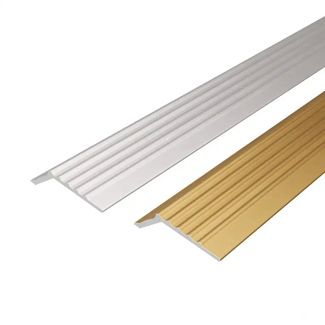 Two metal stair nosings, one white and one gold, on a white background.