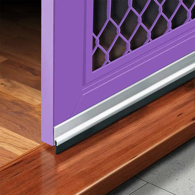 Purple door with a metal threshold on a wooden floor