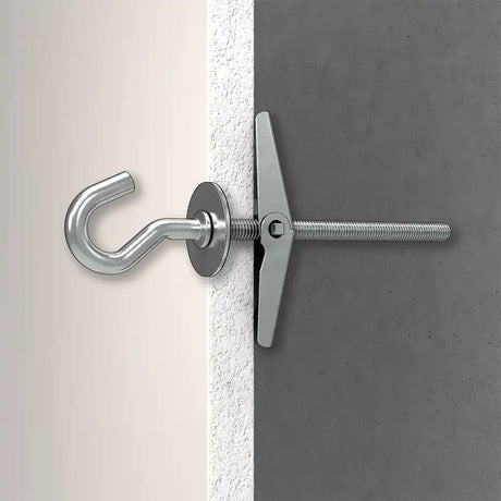 Metal toggle bolt with hook attached to a concrete wall.