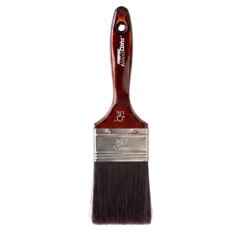 Paint brush with a wooden handle and metal ferrule on a white background