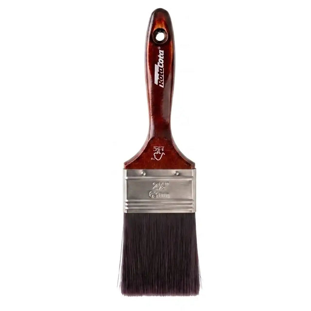 Paint brush with a wooden handle and metal ferrule on a white background