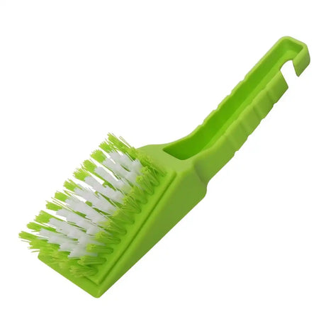 Green cleaning brush with white bristles on a white background