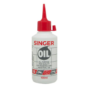 Singer oil bottle with red cap on a white background