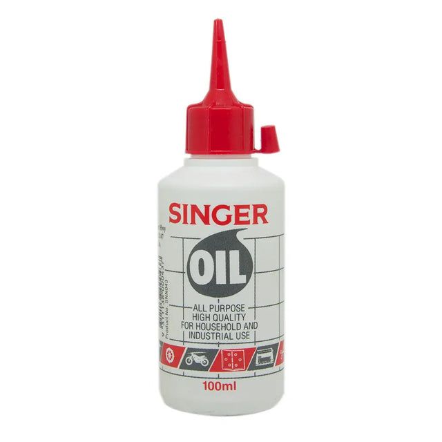 Singer oil bottle with red cap on a white background