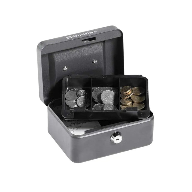 Small metal coin box with coins inside on a white background