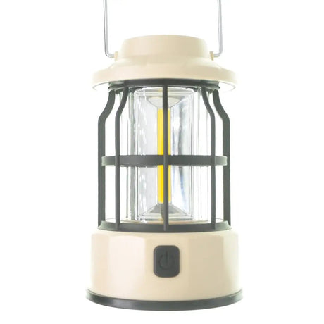 Beige camping lantern with clear glass cover on a white background