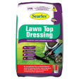 Bag of Searles Lawn Top Dressing with a lawn mower on a white background