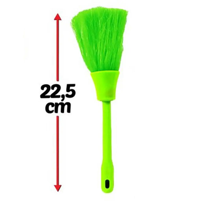 Green brush with measurement label on a white background