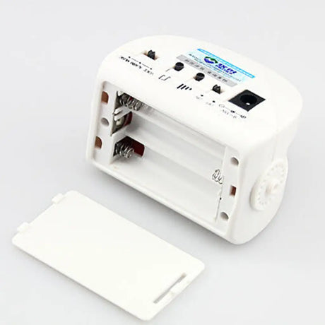 White electronic device with connectors on a light gray background