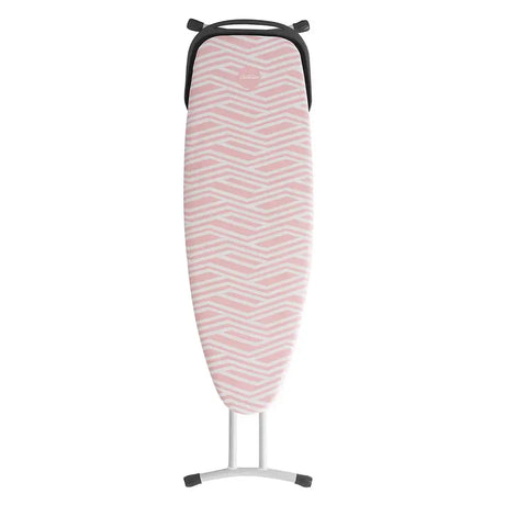 Pink and white zigzag patterned ironing board on a white background
