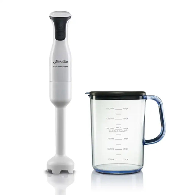 Sunbeam immersion blender with a clear measuring cup on a white background