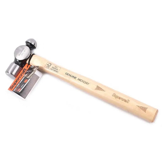 Ball pein hammer with wooden handle and metal head on a white background