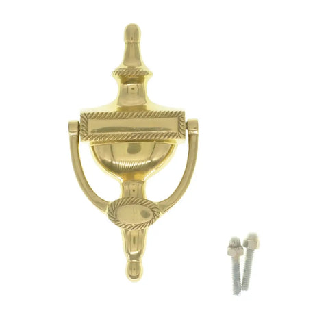 Gold door knocker with installation screws on a white background
