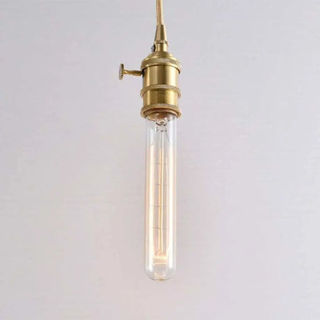 Vintage-style pendant light with brass fixture on a plain background