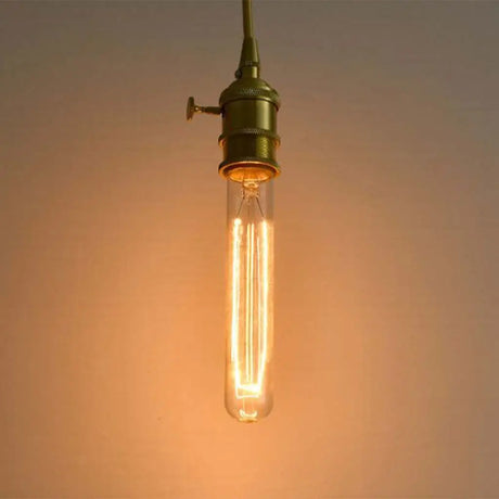 Vintage-style light bulb with a warm glow on a soft background