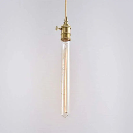 Vintage-style pendant light with brass fixture on a plain background