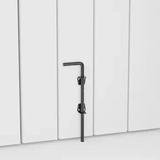 Black drop bolt against a white paneled wall