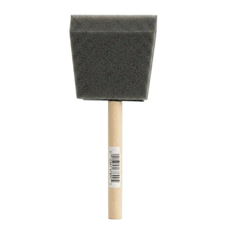 Foam brush with wooden handle on a white background